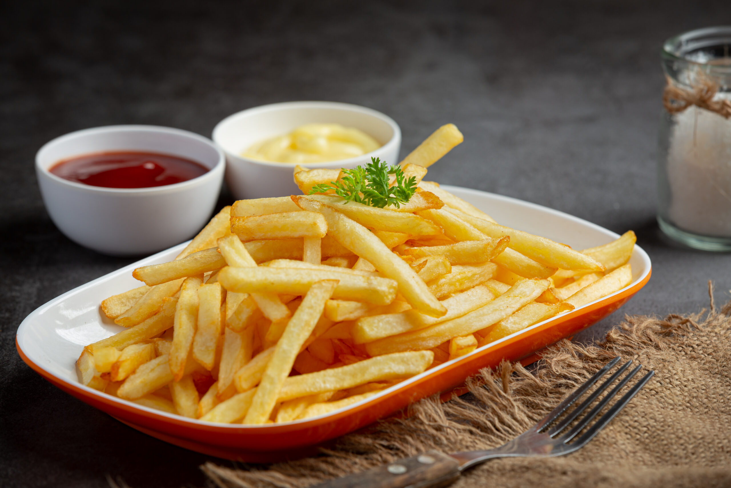 Crispy French fries with ketchup and mayonnaise